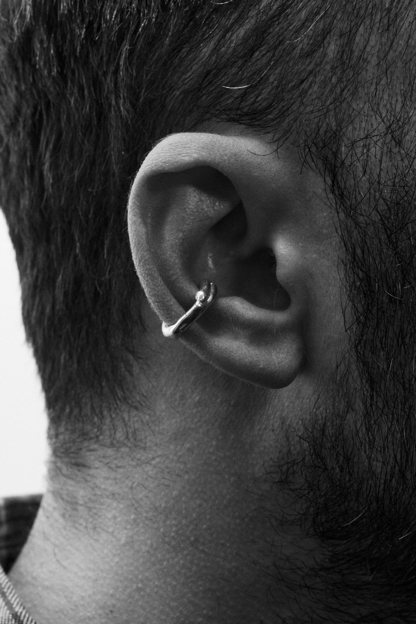 Modern and unique handcrafted silver abstract earcuff. London based long lasting handmade jewellery brand.
