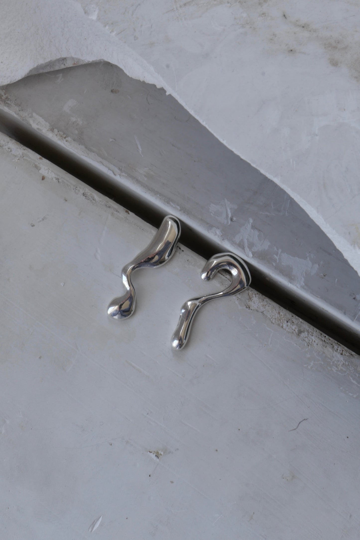 DO YOU DREAM OF ME&nbsp;EARRINGS

Organic asymmetric drop stud silver statement earrings. Available in Recycled NHS X-Ray Silver or 18ct Gold Plate
Handcrafted in London
