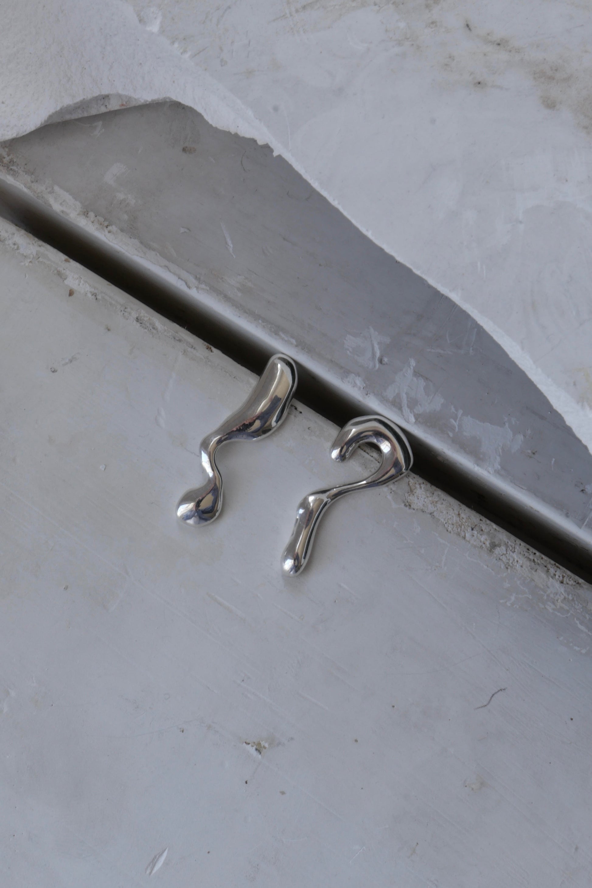 DO YOU DREAM OF ME&nbsp;EARRINGS

Organic asymmetric drop stud silver statement earrings. Available in Recycled NHS X-Ray Silver or 18ct Gold Plate
Handcrafted in London
