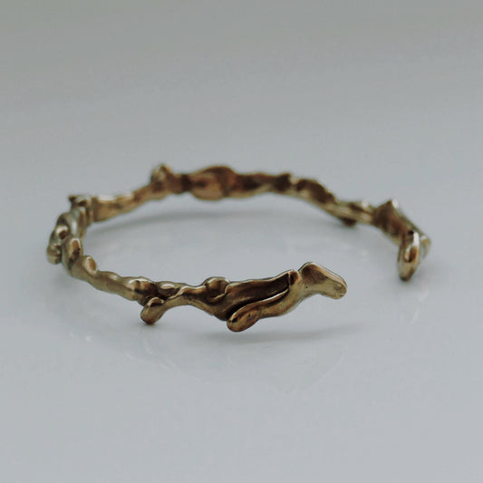 Sustainable abstract modern recycled bronze bracelet. Long lasting jewellery from London based jewellery brand Nowhere Soon Studio.