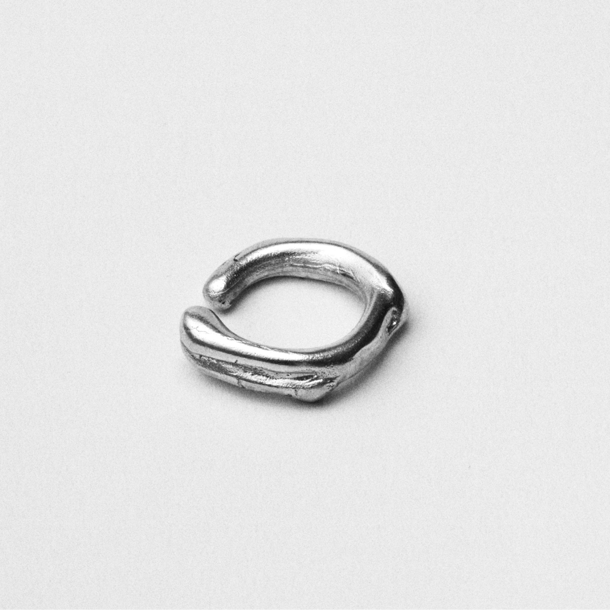  Modern and unique handcrafted silver abstract earcuff. London based long lasting handmade jewellery brand.