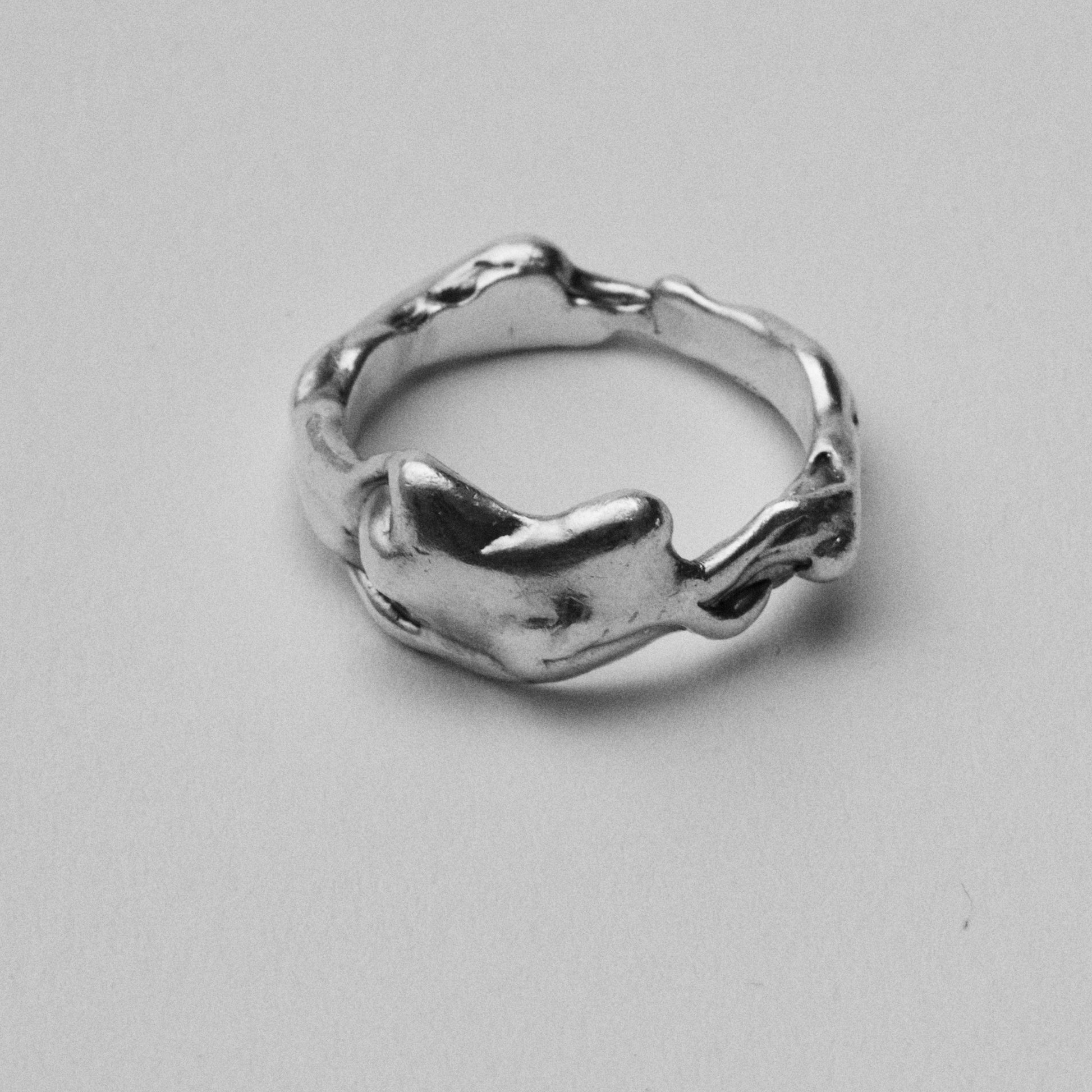 Handmade fluid, molten and unique Caprious Ring, Jewellery made in recycled NHS X-Ray Silver. 