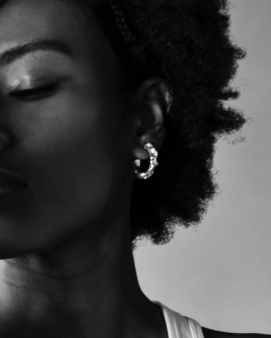 Sustainable recycled silver large abstract hoop earrings. Handcrafted in London. Unique modern jewellery by Nowhere Soon Studio.
